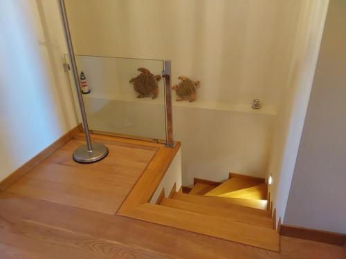 a room with a staircase with a glass case on the floor at Villa Polyxeni 5 Bedrooms and Private Pool in Politiká