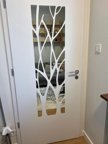 a door with a white door with a window at Buda Top Floor Apartment with Terrace & View in Budapest