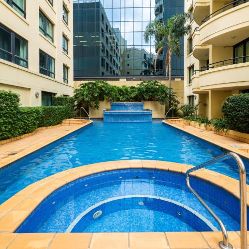 a swimming pool in the middle of a building at 1 Bdr Hotel Style unit in parramatta - Free Parking in Sydney