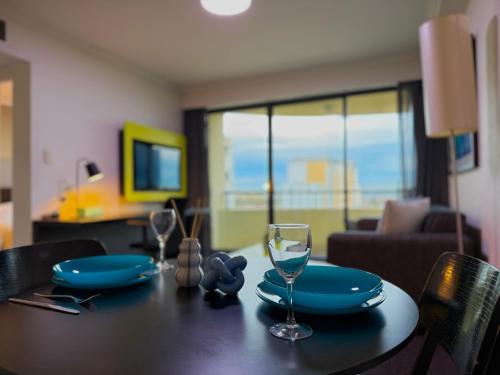 a dining room table with a glass of wine on it at 1 Bdr Hotel Style unit in parramatta - Free Parking in Sydney