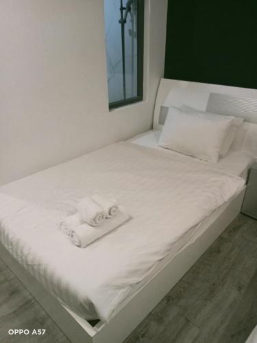 Katil atau katil-katil dalam bilik di Urban Hotel