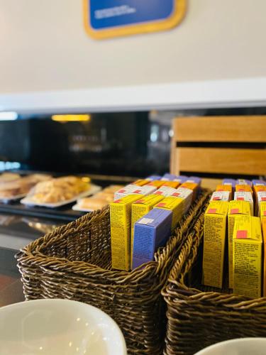 two baskets of food on a counter in a bakery at Belvilla Aberdeen Bridge of Don Sea View in Aberdeen