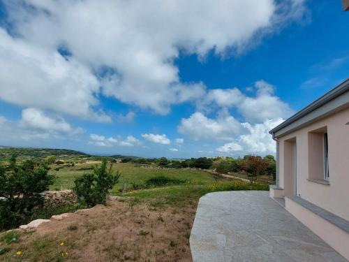 a view of a field from a house at Il Sughereto In Vigna in Aglientu
