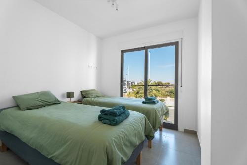 Ένα ή περισσότερα κρεβάτια σε δωμάτιο στο Casa Bos Palm Tree Villa with Pool