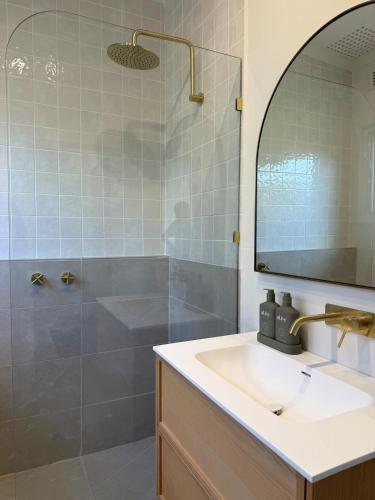 a bathroom with a sink and a shower at 25 Young - 3 Bed, 1 Bath in Tanunda