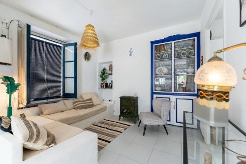 a living room with a couch and a chair at House in the center of Tossa de Mar in Tossa de Mar