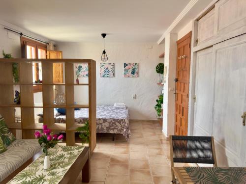 a living room with a couch and a table at Estudio en el Castillo de Denia in Denia