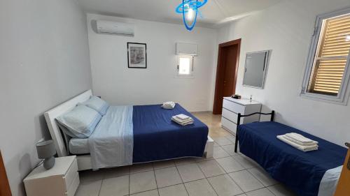 Postel nebo postele na pokoji v ubytování Villa Hermosa Beach