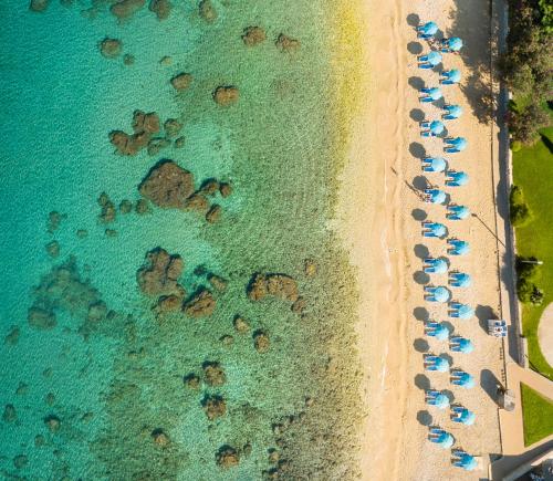 an overhead view of a beach with a bunch of chairs at Maistra Select Mlini Villas and Apartments in Mlini