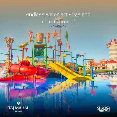 a water park with a water slide in the water at Elegant Apartments & Aquapark - B&B- FREE WI-FI-Sharm El Sheikh in Sharm El Sheikh