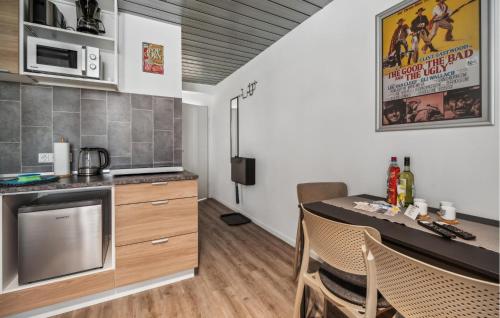 a kitchen with a table and chairs in a room at 1 Bedroom Nice Apartment In Oberhof in Oberhof