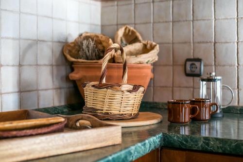 a basket sitting on top of a counter in a kitchen at Echo Traditional House - Ηχώ Παραδοσιακό Σπίτι in Émbonas