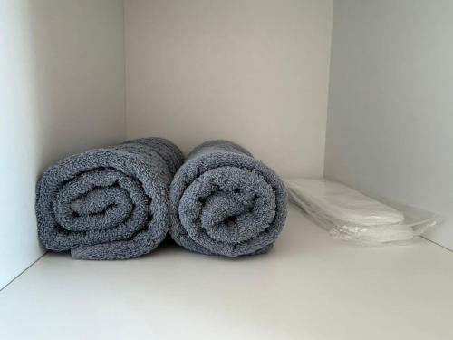 a pile of towels on the floor of a bathroom at Chill and Stay-Luxury Studio in Kato Paphos in Paphos City
