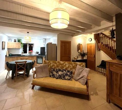 a large living room with a couch and a table at Loustalot in Aydius