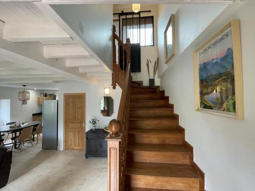 a staircase in a home with a living room at Loustalot in Aydius