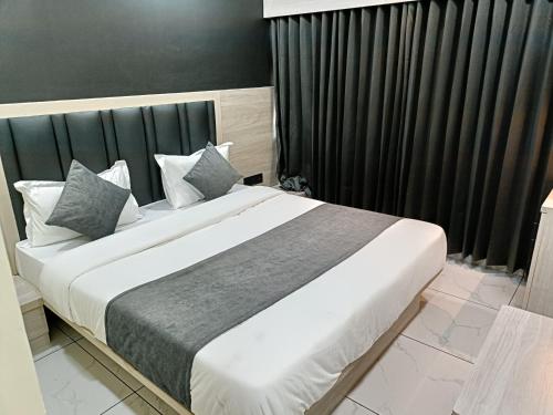 Postel nebo postele na pokoji v ubytování Hotel Sun PLaza