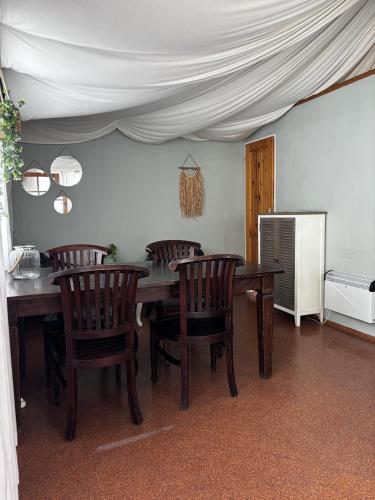a dining room with a wooden table and chairs at Camping 2000 - Glamourtent in Osečná