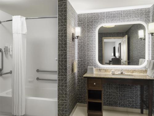 a bathroom with a sink and a mirror at Homewood Suites by Hilton Akron/Fairlawn in Akron
