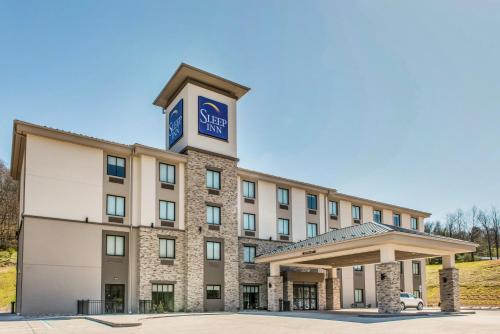 a hotel with a clock tower on top of it at Sleep Inn Ellenboro Hwy 50 in Ellenboro