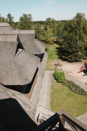 an overhead view of a house with a roof at Porto Resort in Lilaste