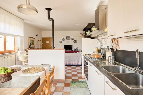 a kitchen with a sink and a counter top at Villa PoliFlora in Monticchiello