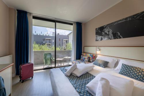 Hotel Holiday Sport & Relaxにあるベッド