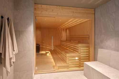 a walk in shower with a glass door in a bathroom at Maistra Select Mlini Hotel in Mlini