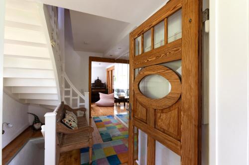 a room with a wooden door with a mirror at Villa Sophie in Bad Herrenalb