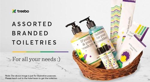 a basket with someentedentedented toothbrushes and toothpaste at Treebo Premium Niraali Executive, Hinjewadi in Pune