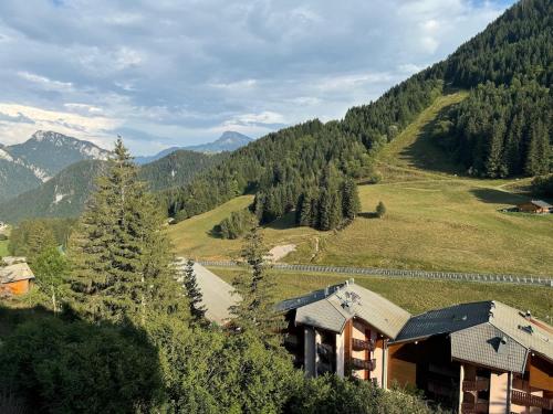 a house in the middle of a valley with mountains at 2-bed appt 20 mins from Morzine Portes du Soleil French Alps in La Baume