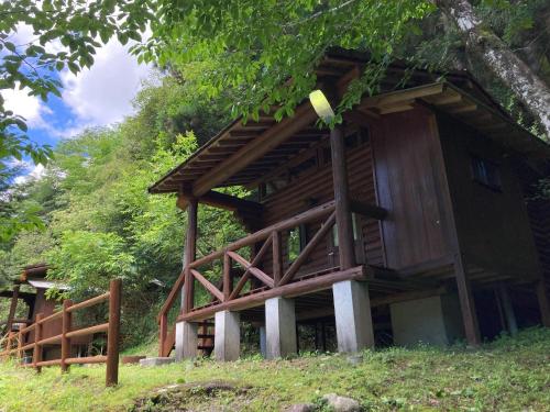 a tree house sitting on top of a hill at Nature Resort in Shimanto / Vacation STAY 33192 in Funato