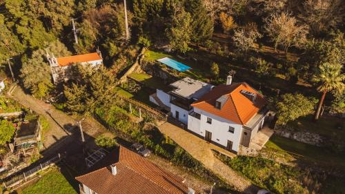 an overhead view of a house with an orange roof at Casa do Outeiro in Lanhelas