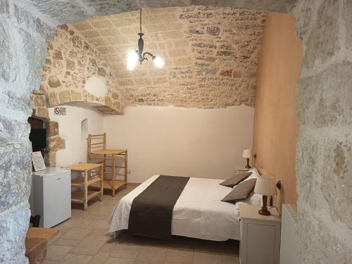 Postel nebo postele na pokoji v ubytování B&B Il Mulino del Monastero