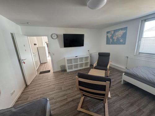 TV a/nebo společenská místnost v ubytování Monteurwohnung Giebolehausen