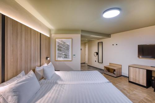 Postel nebo postele na pokoji v ubytování VITA Hotel