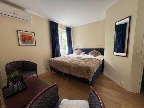 Postel nebo postele na pokoji v ubytování Inge Villa Apartment Hotel
