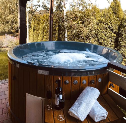 a jacuzzi tub sitting on a deck at Magiczny Zakątek Bałtów in Bałtów