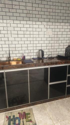 a kitchen with a counter with a pot on it at PD WORLD MARINa in Port Dickson