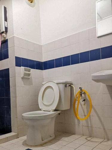 a bathroom with a toilet and a sink at PD WORLD MARINa in Port Dickson