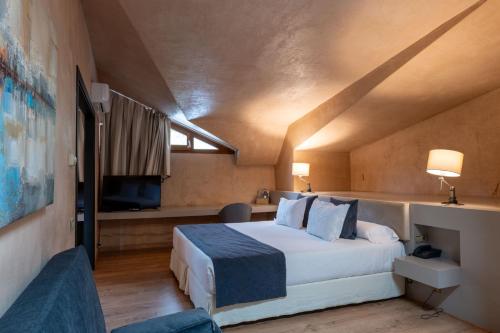 Кровать или кровати в номере Hotel Xalet del Golf