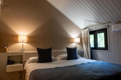 Кровать или кровати в номере Hotel Xalet del Golf