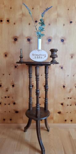 a table with a vase on top of it at Landhaus Rasser in Rauris