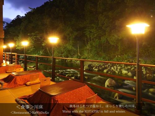 a group of tents on a balcony at night at Tatsuta Ryokan in Izu