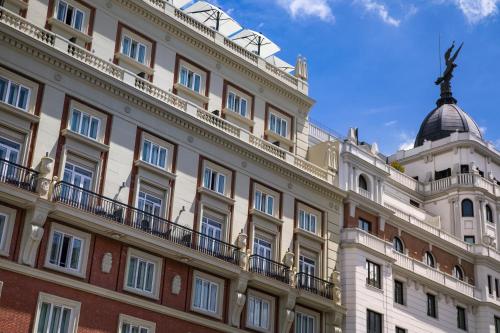 a building with a dome on top of it at Catalonia Plaza España Hotel & Spa in Madrid