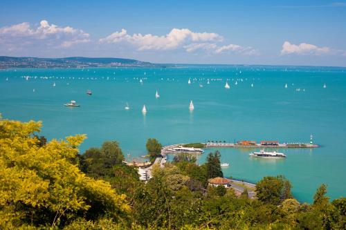 a view of a large body of water with boats at Fülöp Panzió Apartments near Lake Balaton in Révfülöp