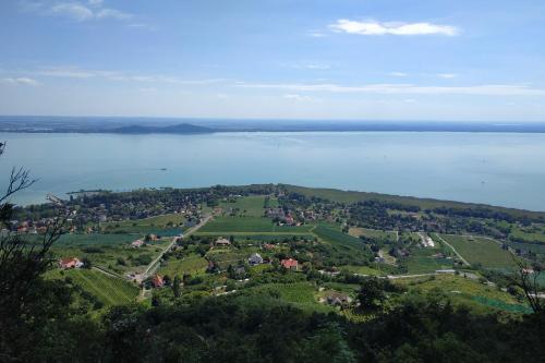 an island in the middle of a large body of water at Fülöp Panzió Apartments near Lake Balaton in Révfülöp