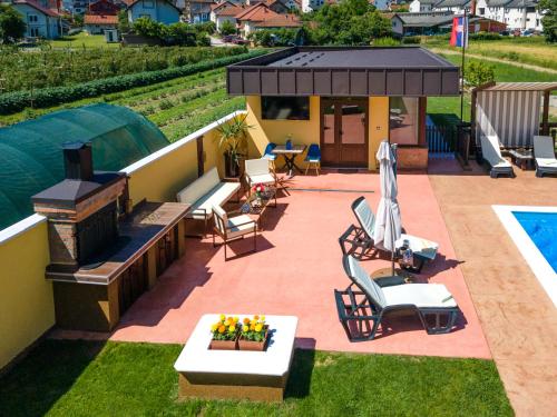 a backyard with a swimming pool and a patio at BRICK Studio in Bajina Bašta