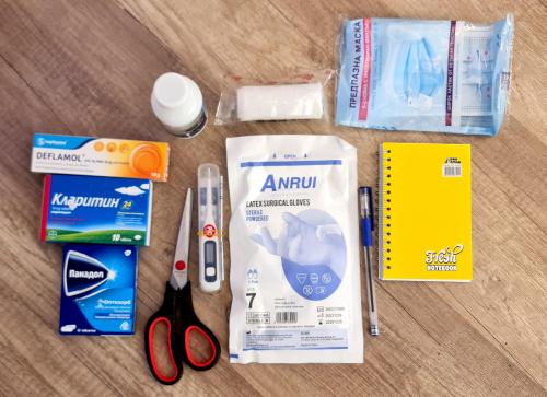 a group of items sitting on a table with scissors at Morava 1 Asparuhovo Beach Holiday House in Varna City