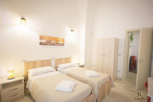 Postel nebo postele na pokoji v ubytování RC Apartment