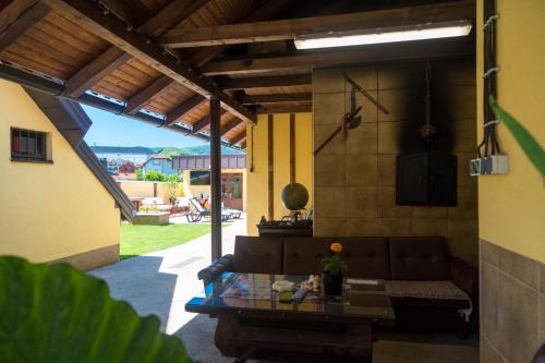 a living room with a couch and a table at BRICK APARTMENT in Bajina Bašta